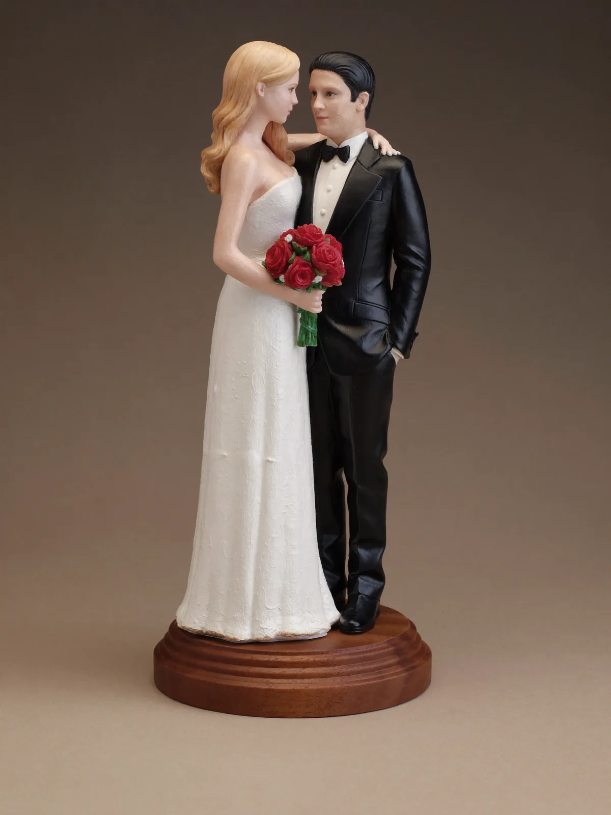 Hand-painted sculpture of a wedding couple